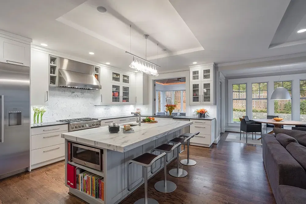 Examples of open concept kitchens with white cabinetry