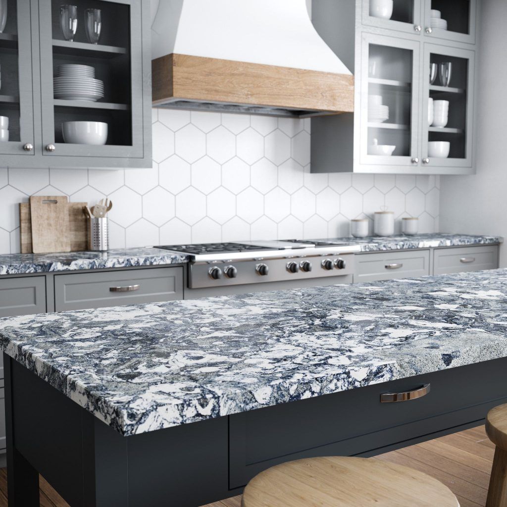 Modern kitchen with bold granite countertop and gray shaker cabinets