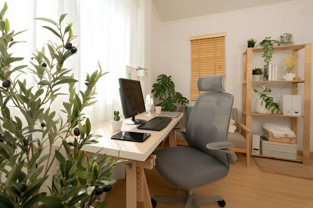 20 Inspiring Small Garage Conversion Ideas 11 Bright home office with a modern desk, ergonomic chair, plants, and wooden shelving