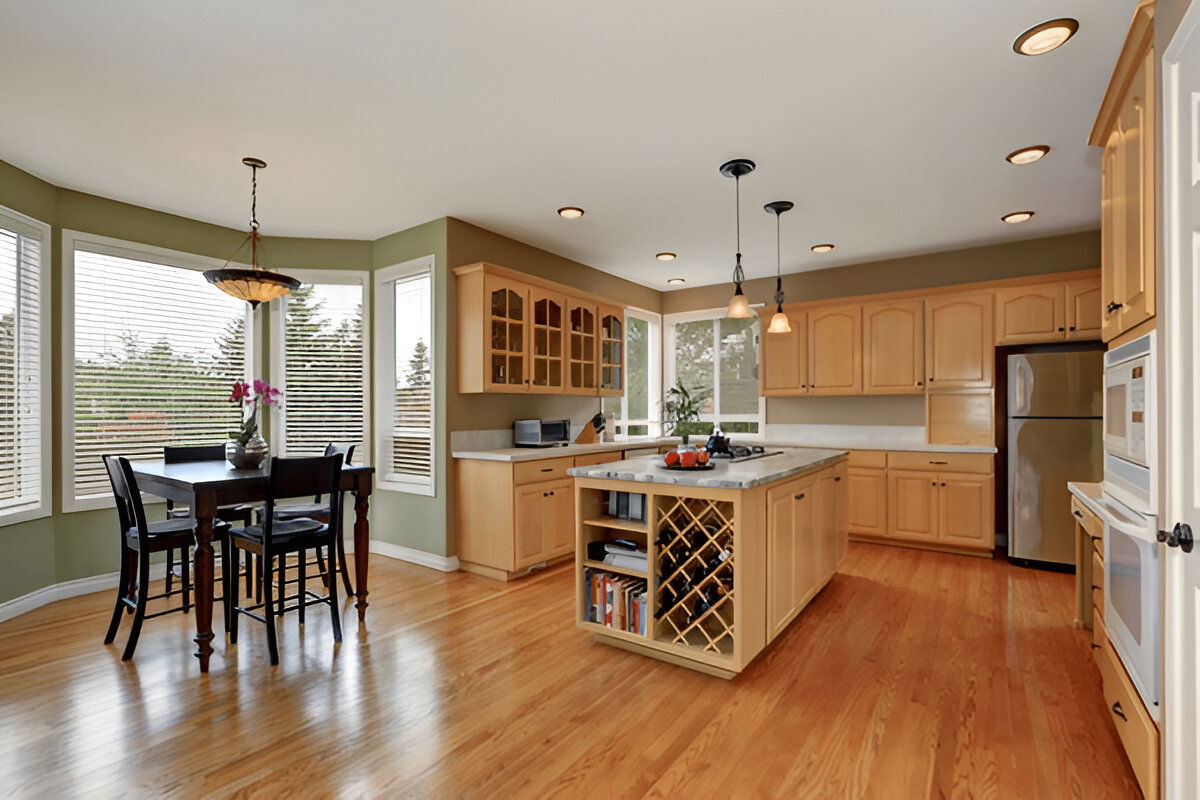 Traditional kitchen with natural wood cabinets and island
