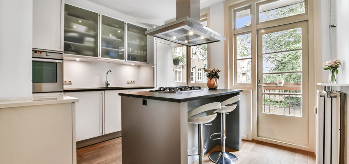 Contemporary kitchen with island and glass cabinets