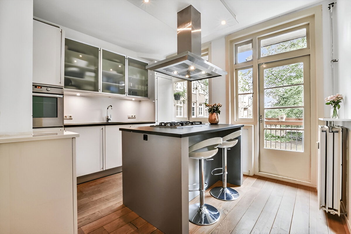 Contemporary kitchen with island and glass cabinets