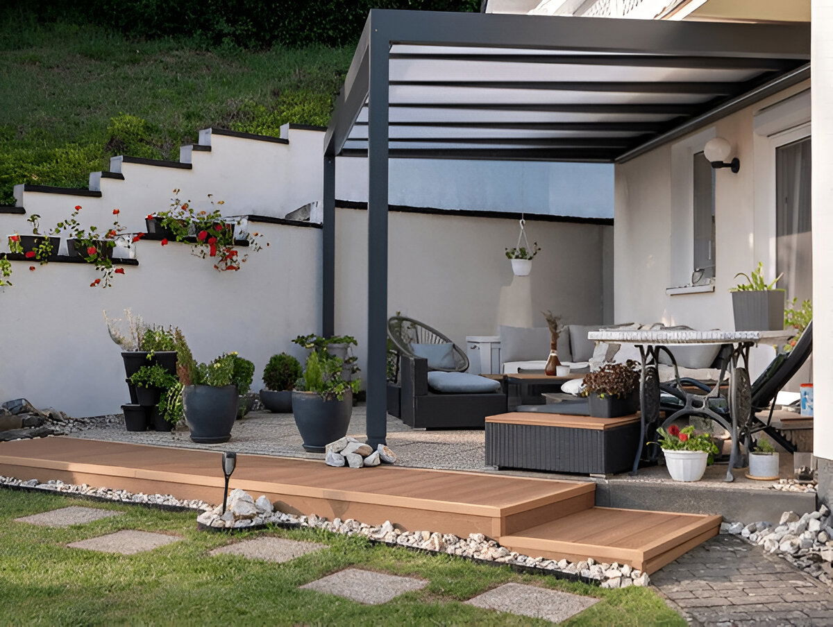 Cozy backyard patio with modern pergola, lounge seating, and potted plants