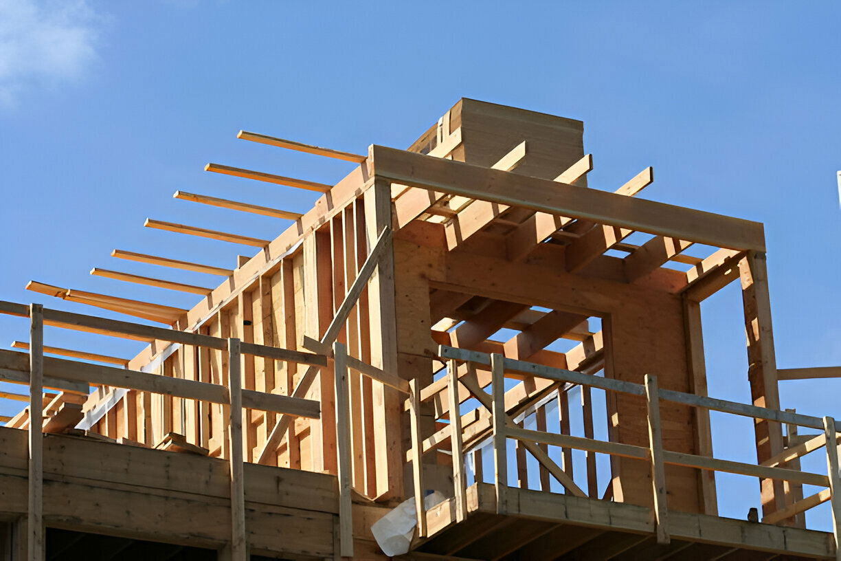 Second floor addition under construction with wood framing. 