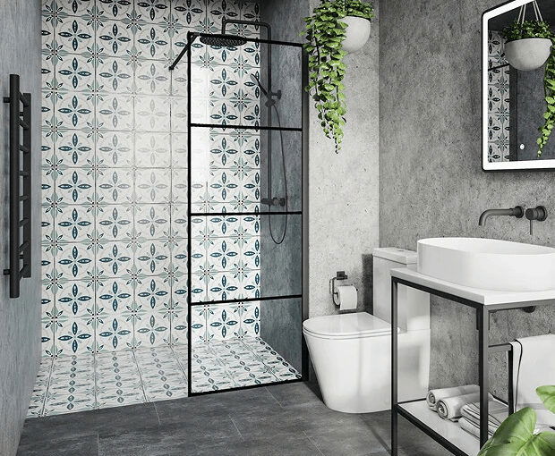 Modern small bathroom with patterned tile shower wall, black-framed glass shower, and concrete walls