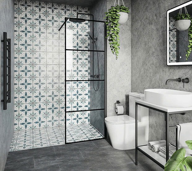 Modern small bathroom with patterned tile shower wall, black-framed glass shower, and concrete walls