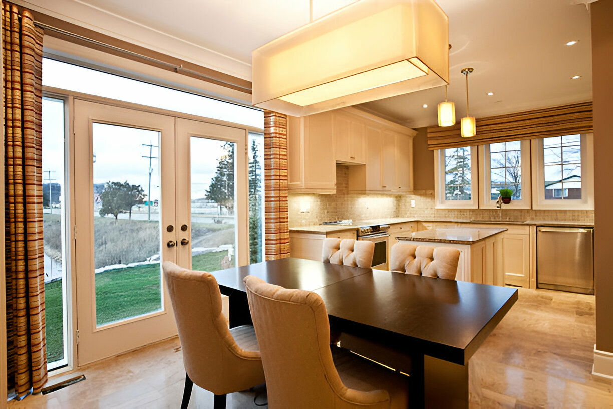 Elegant kitchen with dining table and large French doors