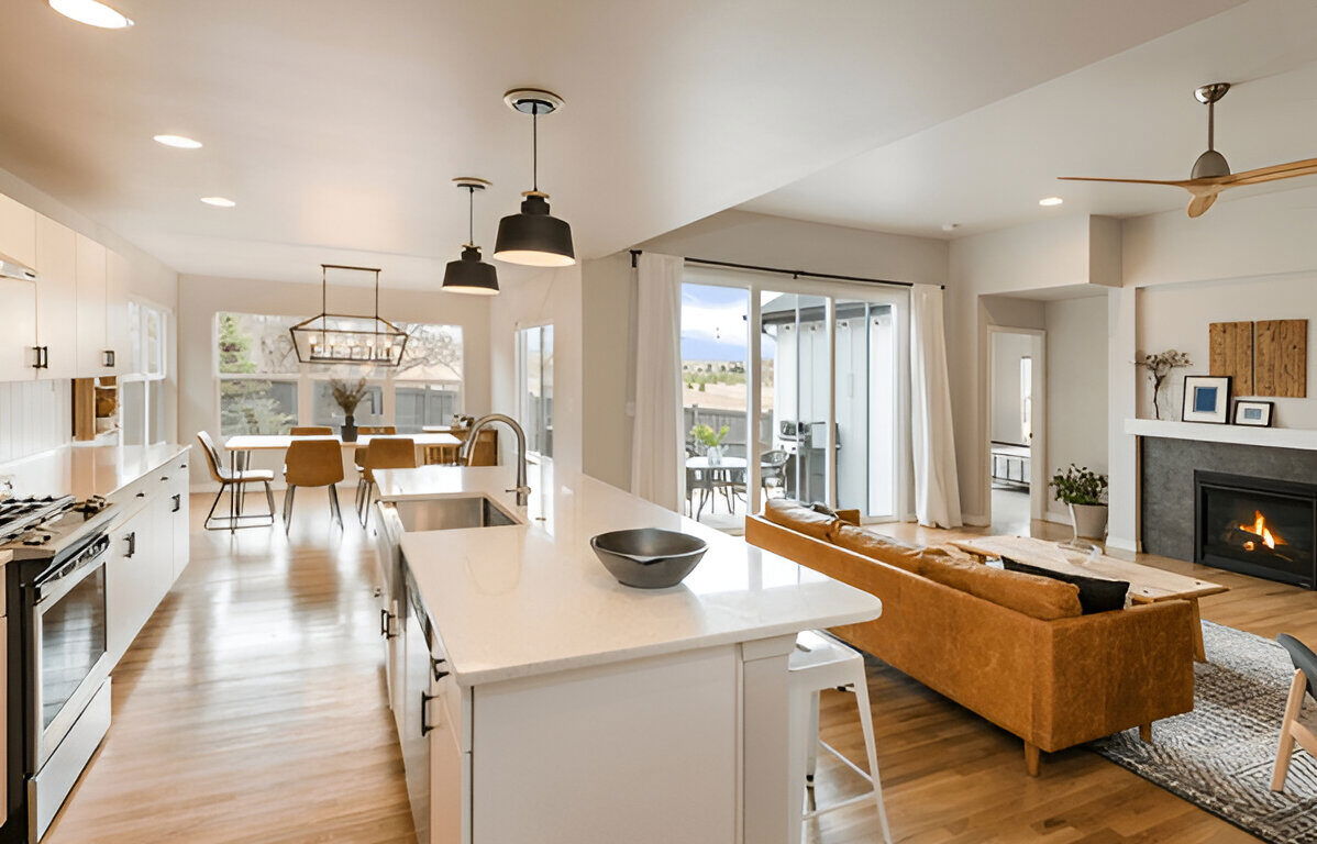 Open concept kitchen and living area with island and fireplace