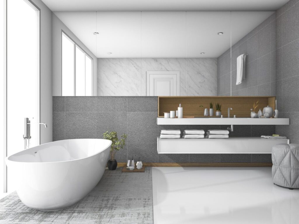 Modern minimalist bathroom with a sleek freestanding tub, floating vanity, large mirror, and neutral gray-white tones